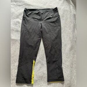 Nike Grey running cropped leggings sz Sm with yellow accents and hidden pocket
